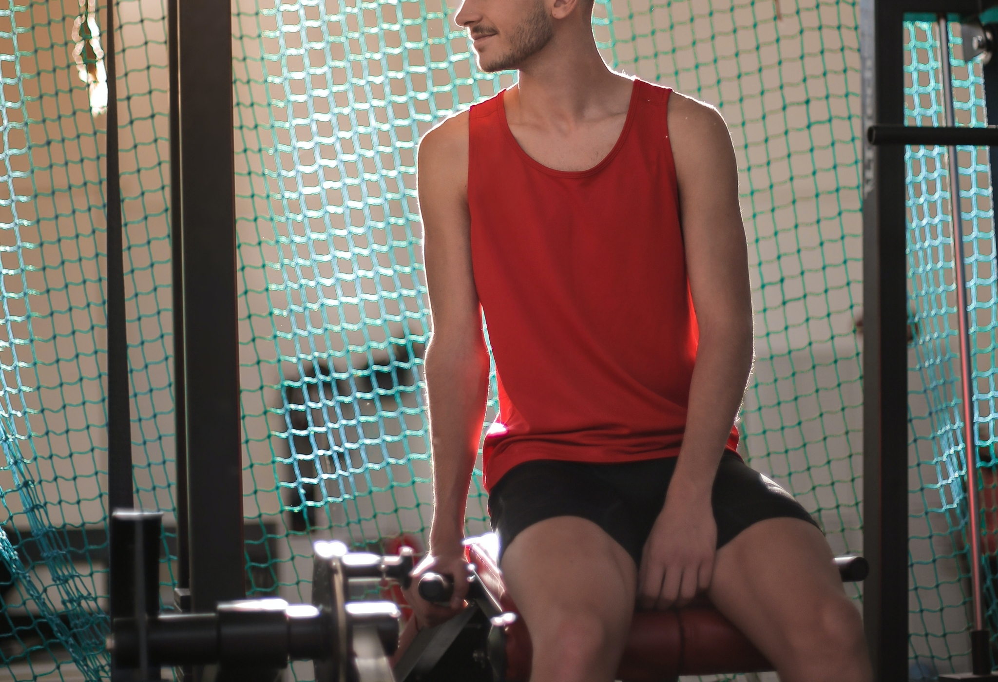 slim man wearing shorts in gym