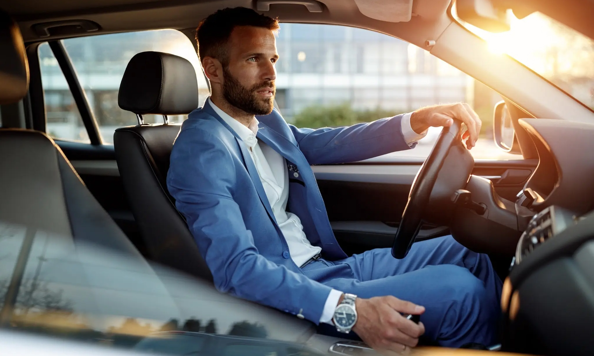 stylish man sitting in car