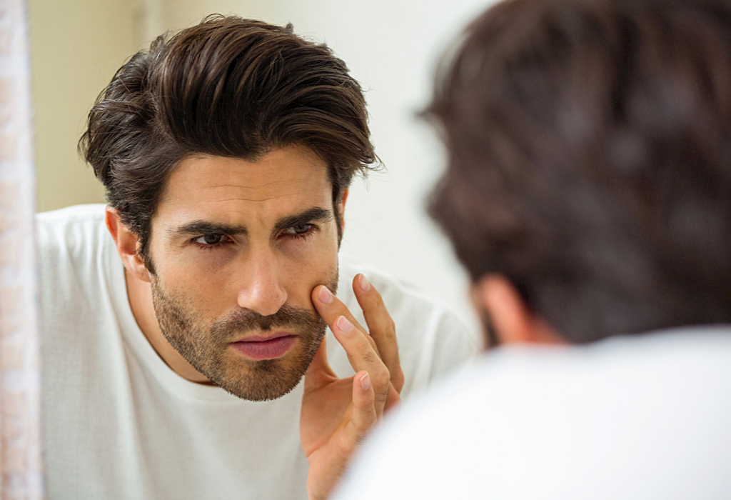 Man looking at beard